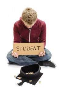 student with sign and cap asking for money